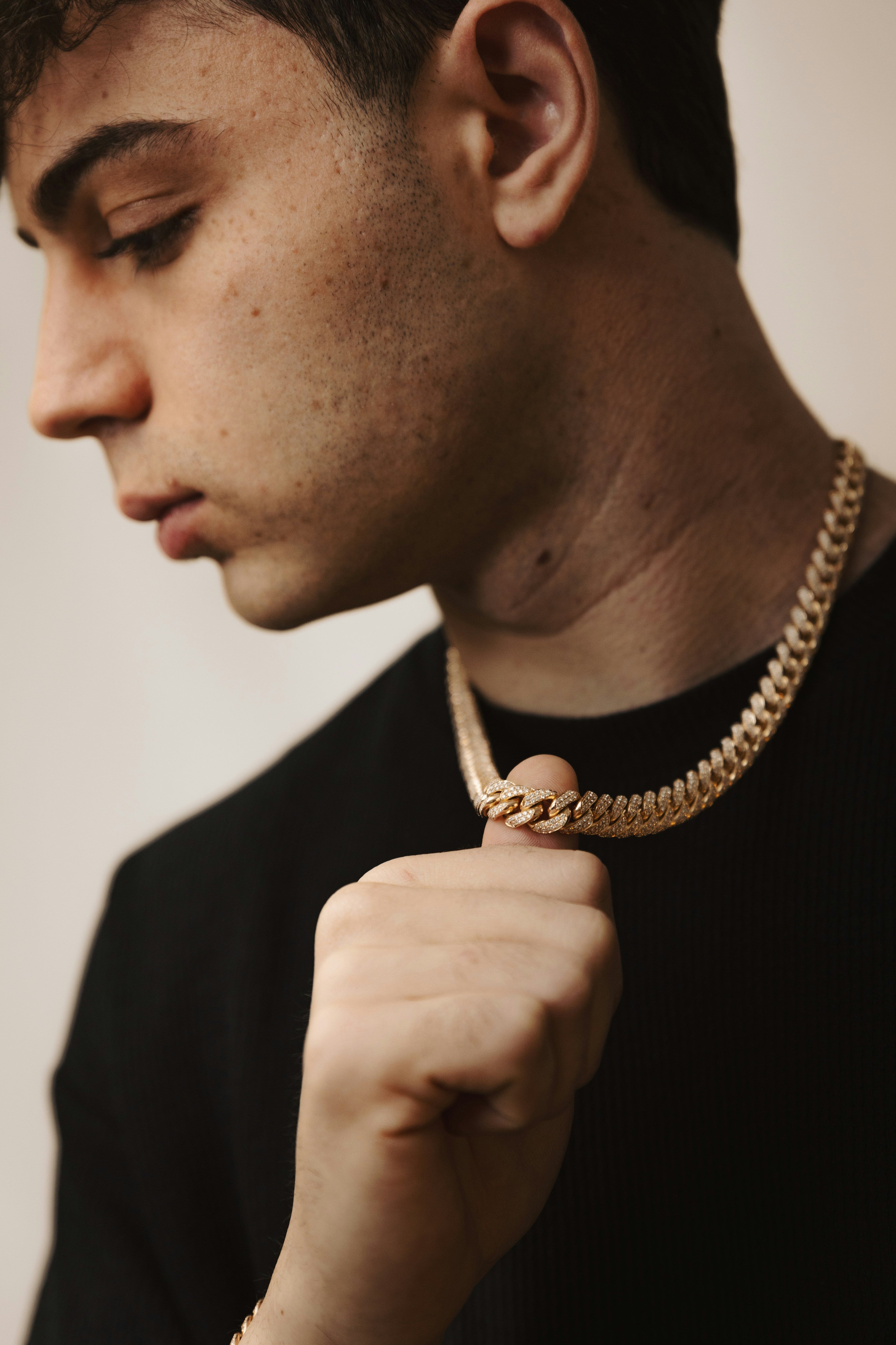 Close-up of gold Cuban chain necklace for men, luxury hip hop jewelry style
