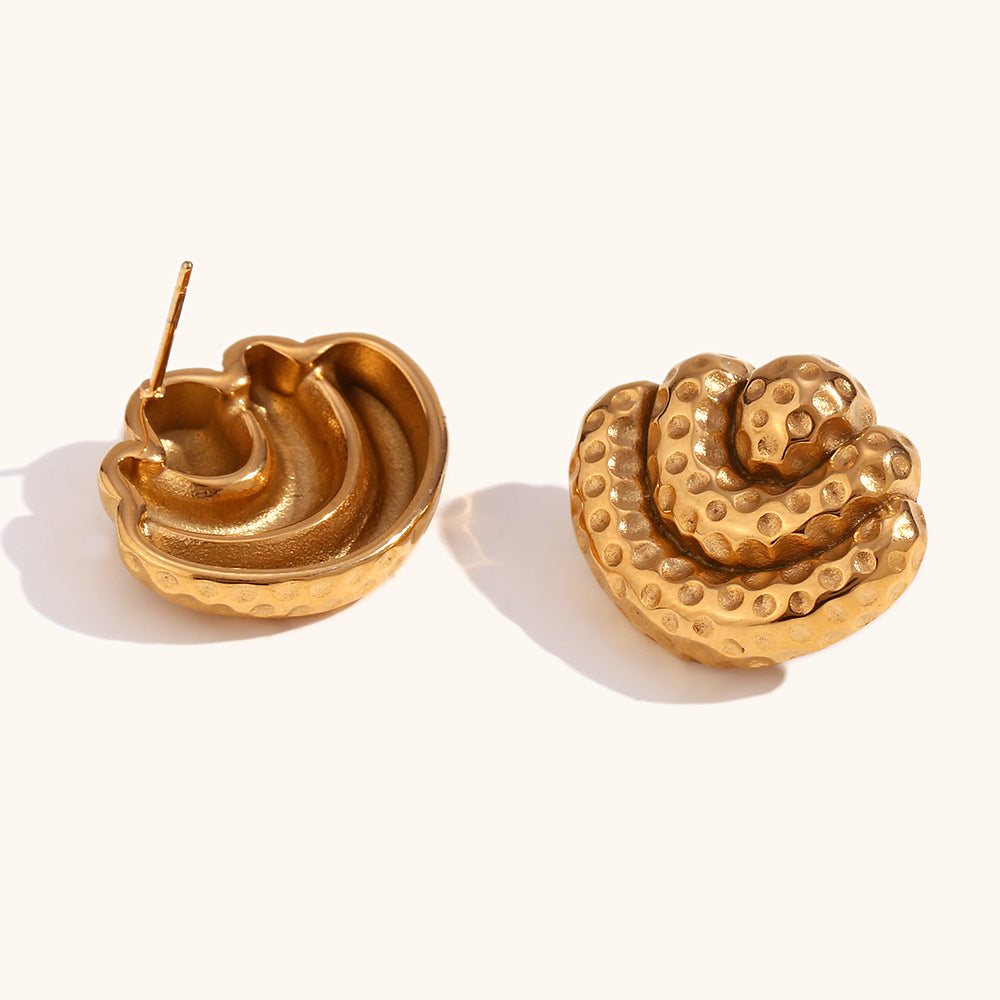 Gold layered earrings with flowing structure and movement