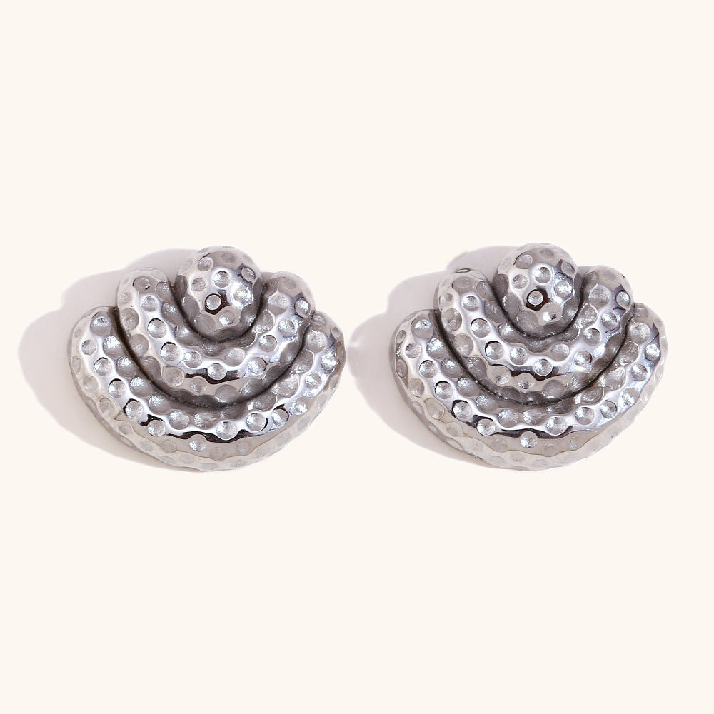 Close-up of layered scallop curves elegant drop earrings