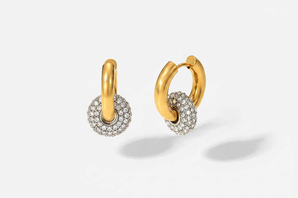 Close-up of zircon stones reflecting light on drop earrings
