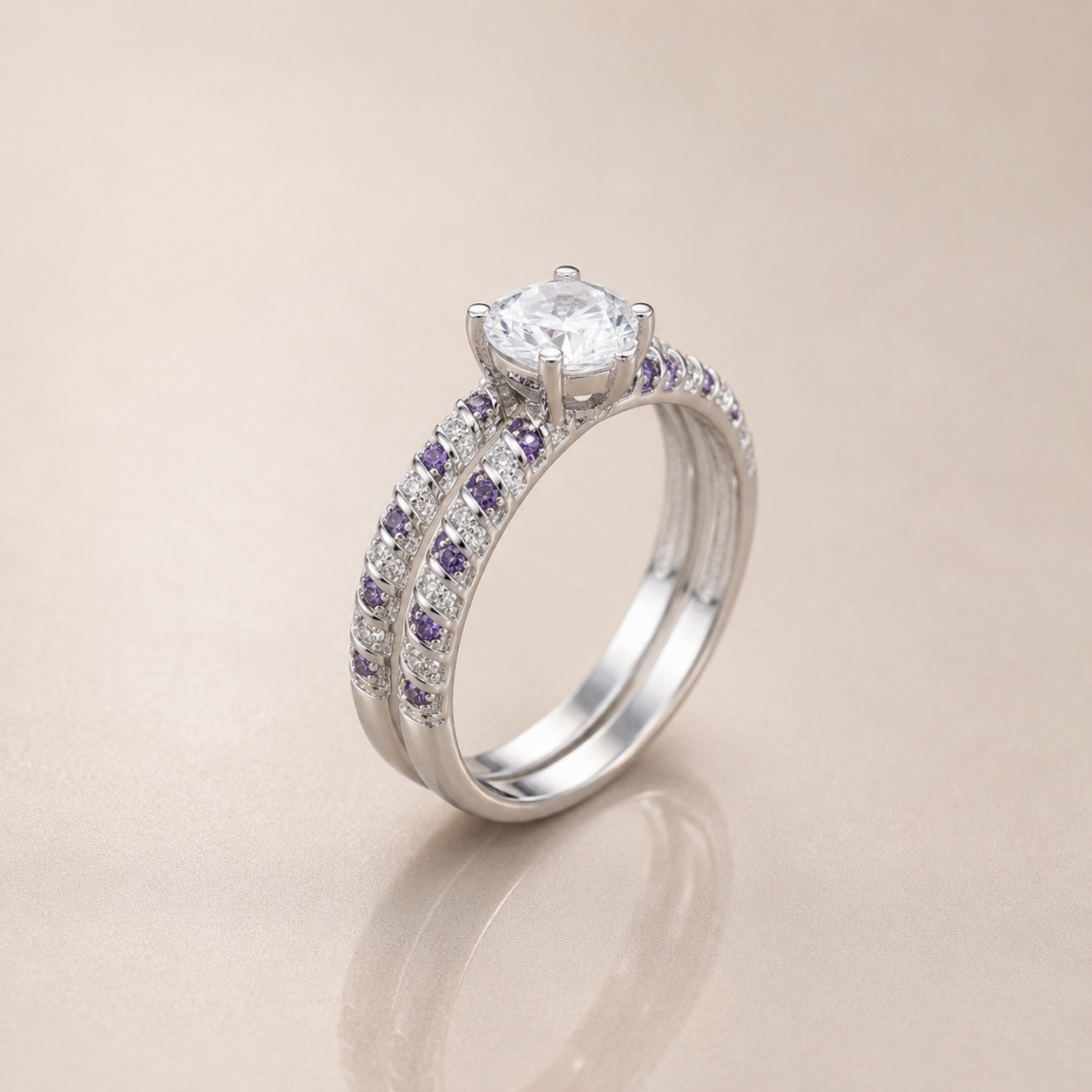 Silver ring with a central diamond and smaller purple gemstones